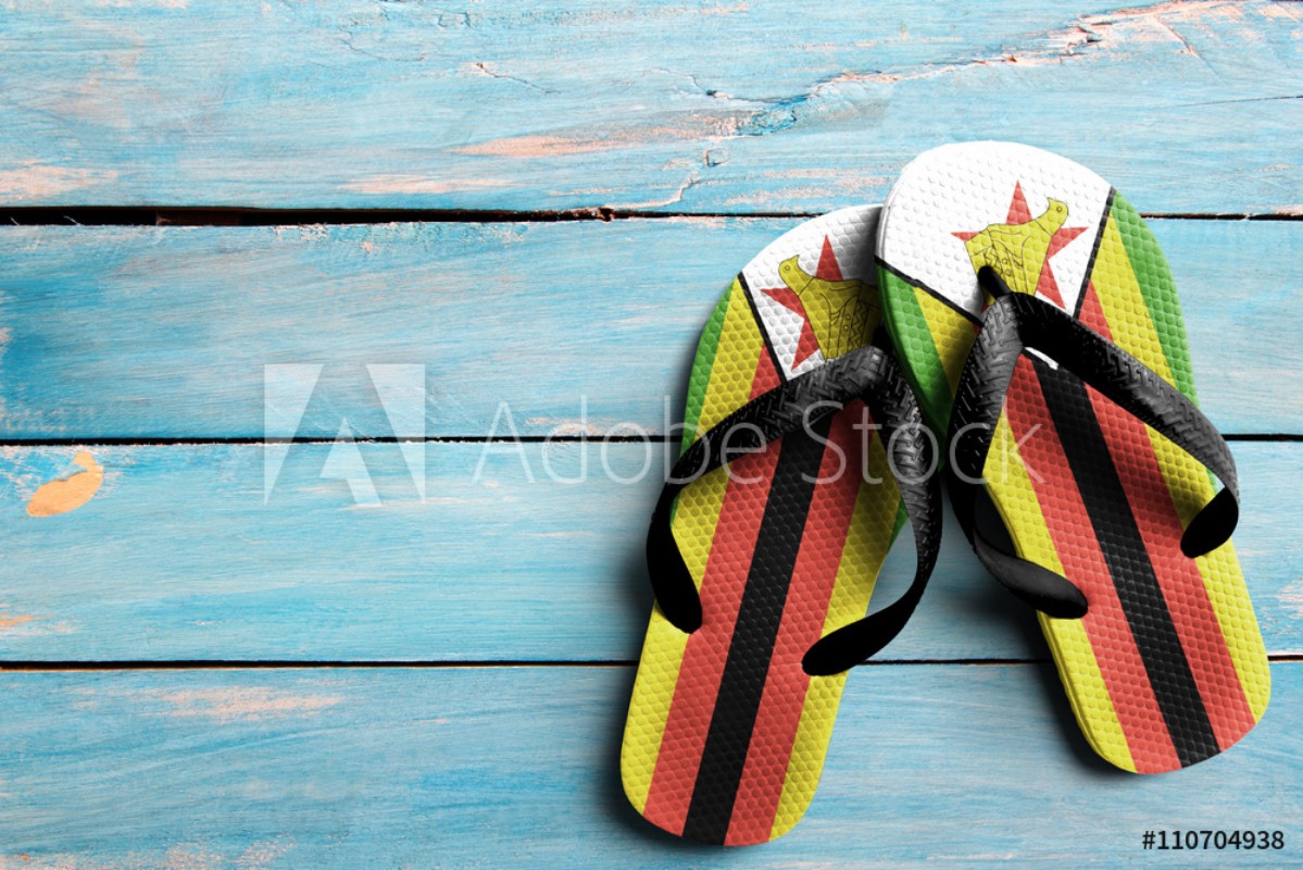 Image de Thongs with flag of Zimbabwe on blue wooden boards